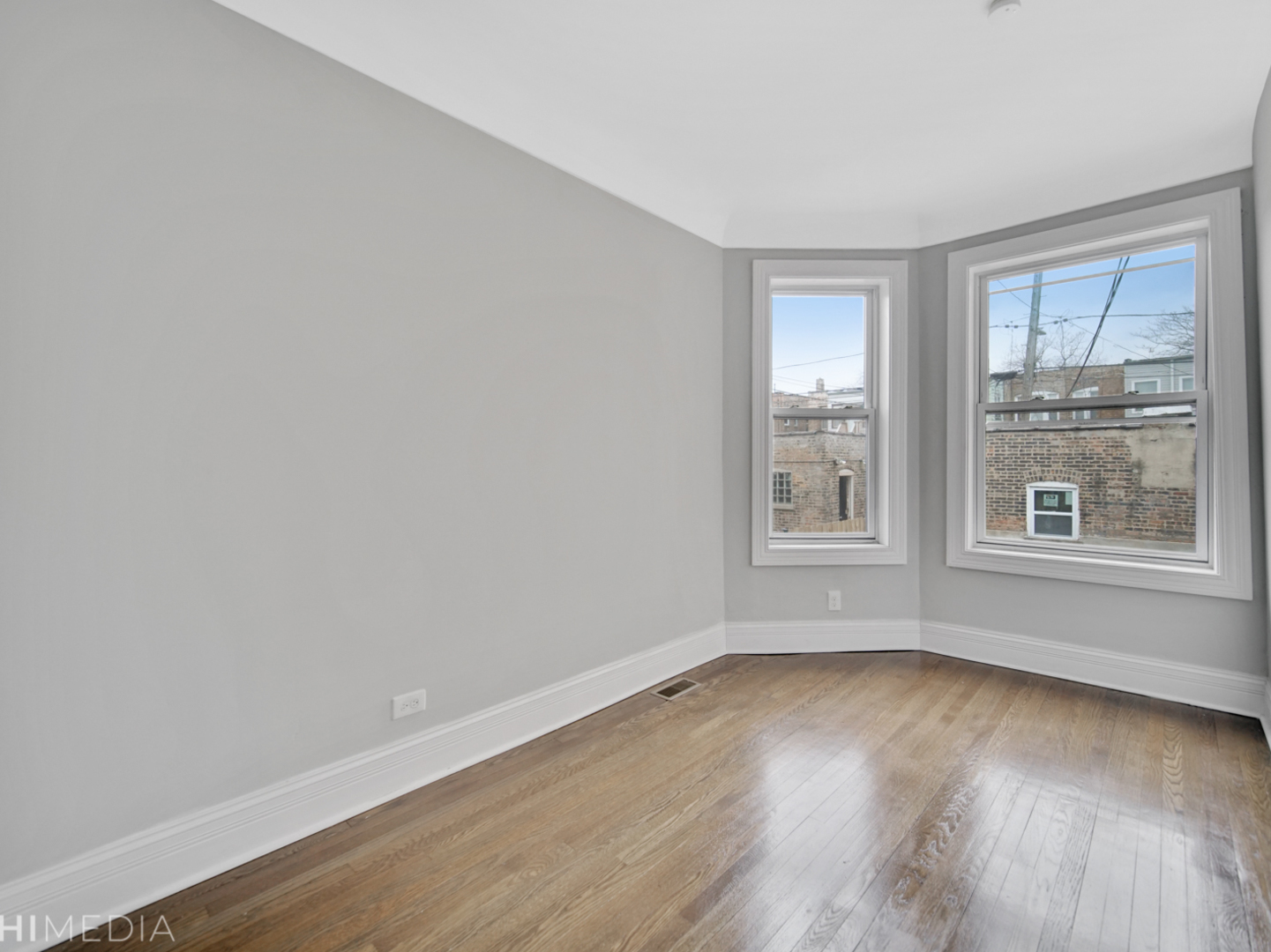 6234 South Rhodes Avenue Chicago, IL 60637 - Photo 27 of 36 wooden floor in an empty room with a window