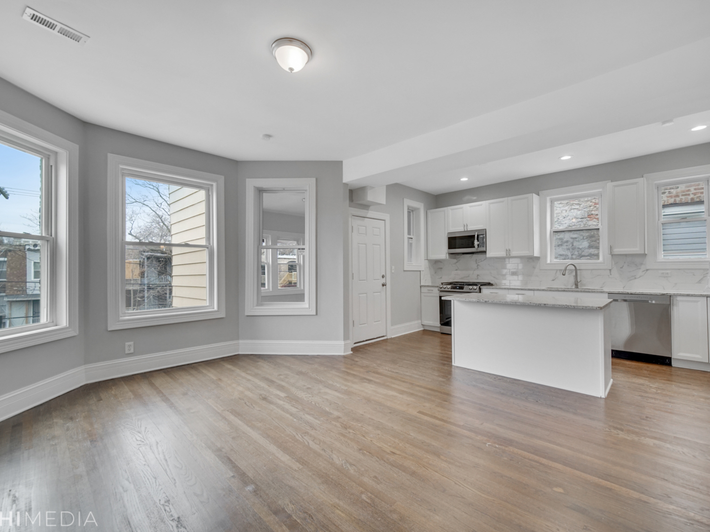 6234 South Rhodes Avenue Chicago, IL 60637 - Photo 10 of 36 a view of kitchen with wooden floor and windows