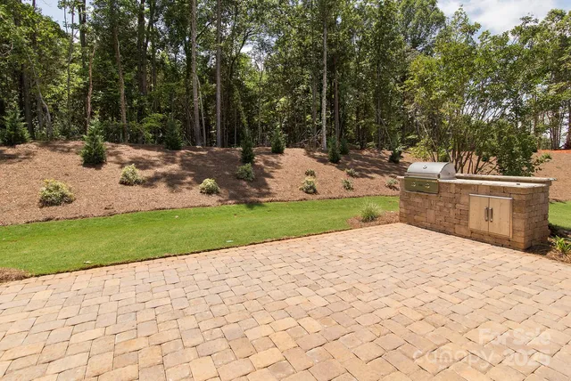 a view of a backyard of the house