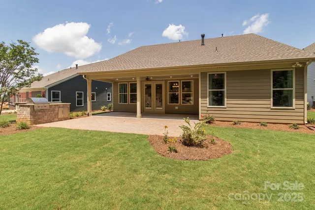 a house with swimming pool in front of it