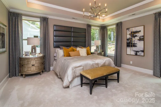 a bedroom with furniture and a chandelier