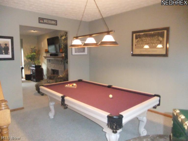 3795 Stonebridge Boulevard Akron, OH 44321 - Photo 11 of 24 The living room sits next to the family room. It also features neutral carpet.