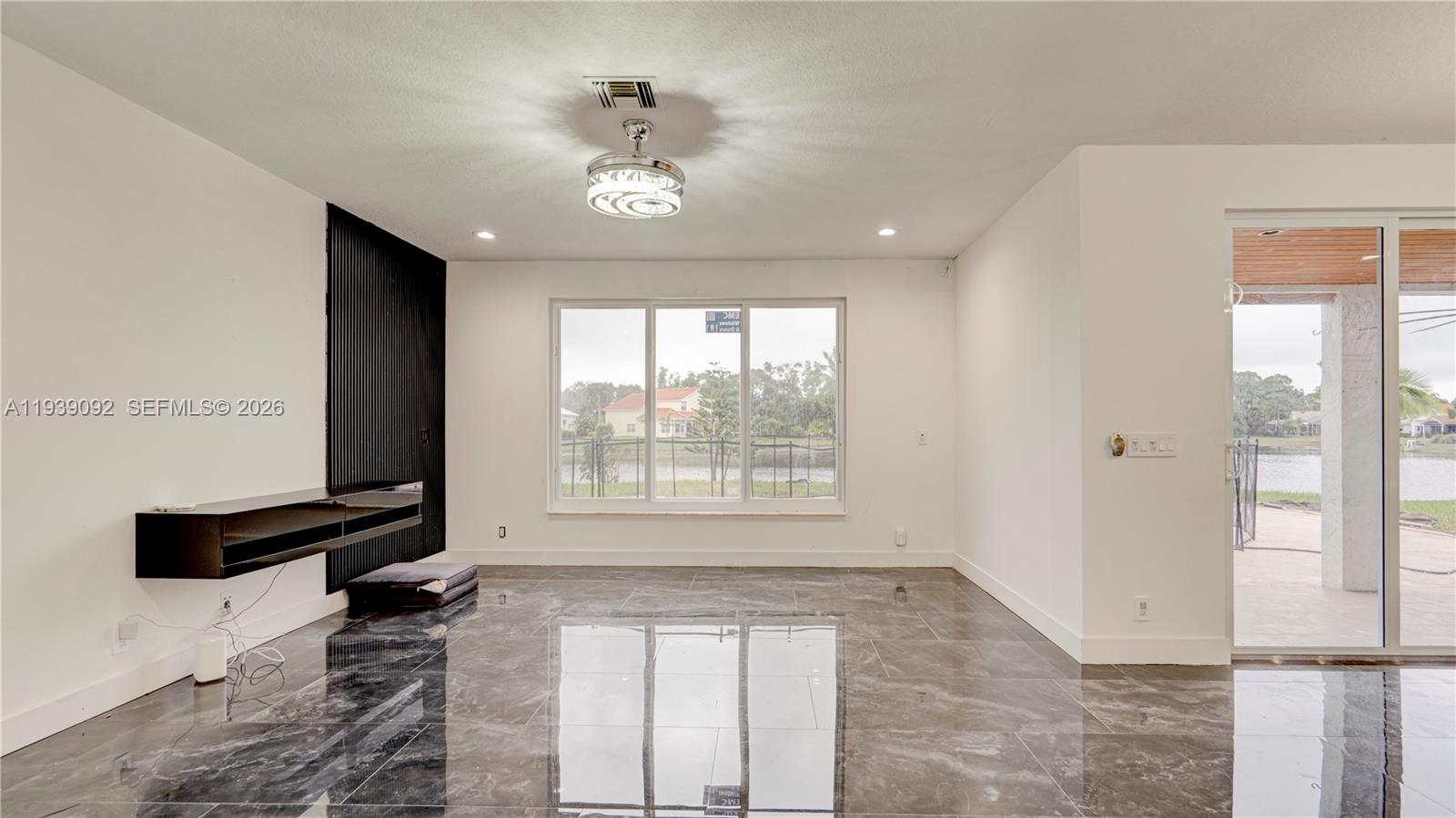 7109 Waldon Pond Stuart, FL 34997 - Photo 12 of 20 a view of an empty room with a window