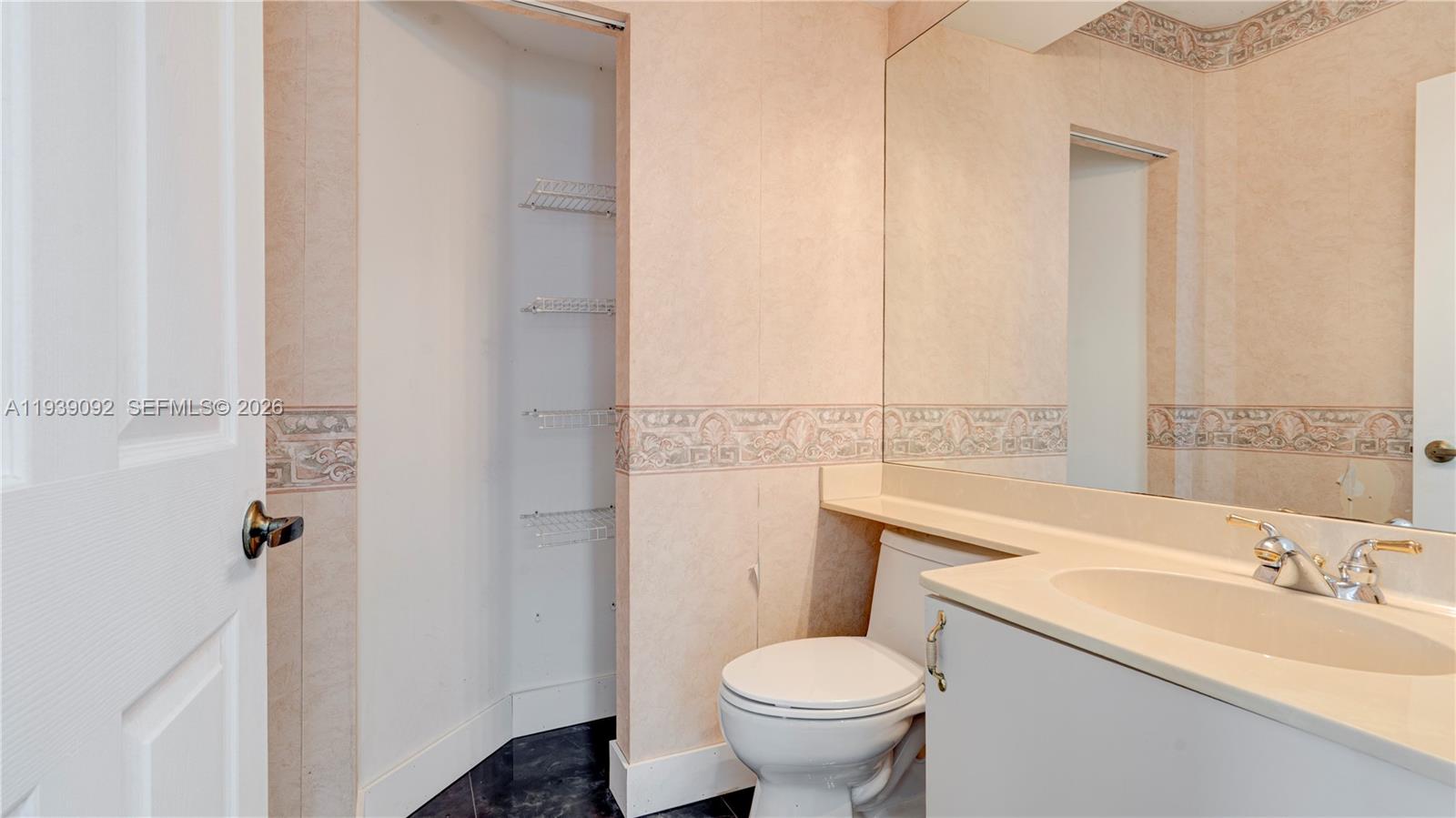 7109 Waldon Pond Stuart, FL 34997 - Photo 14 of 20 a bathroom with a sink toilet and shower