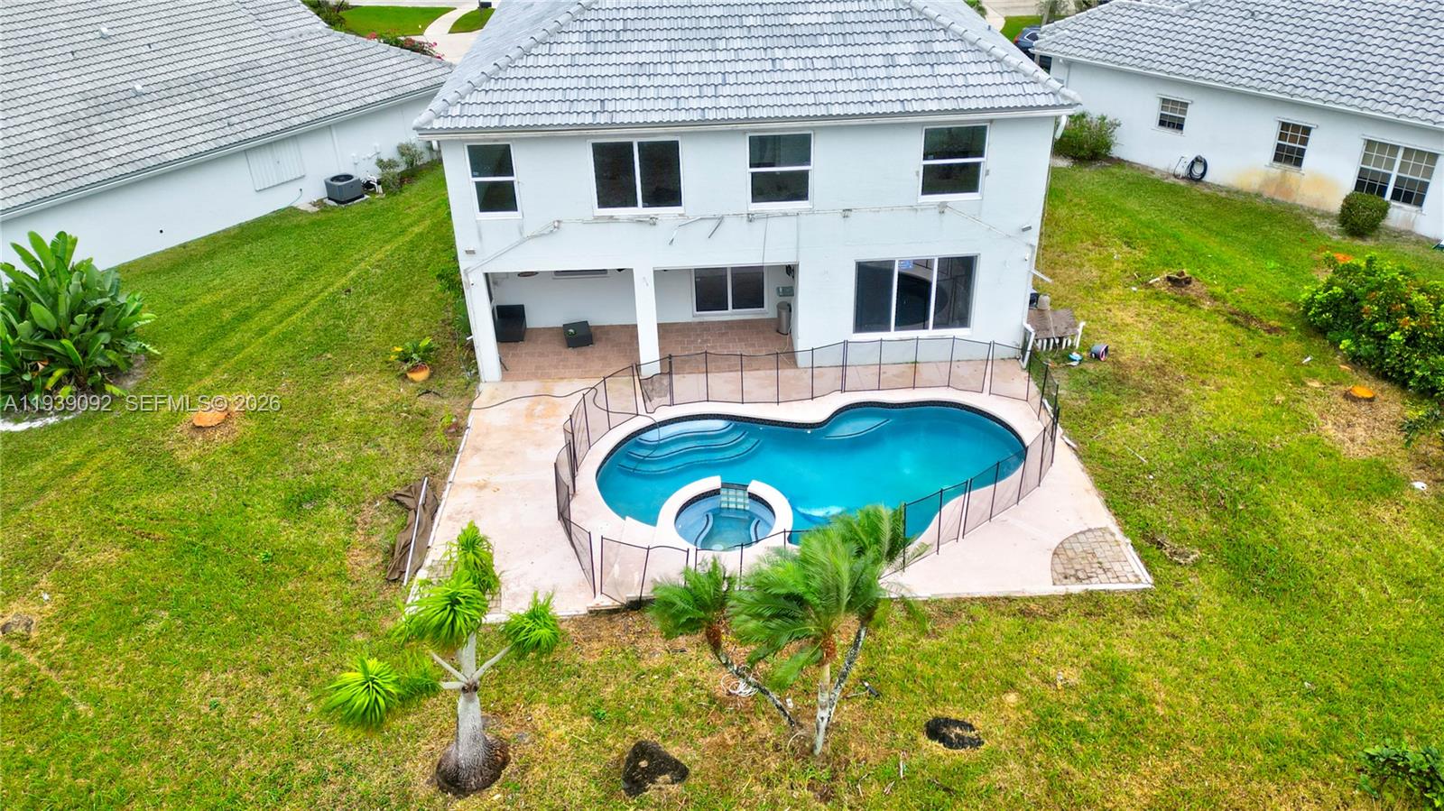 7109 Waldon Pond Stuart, FL 34997 - Photo 4 of 20 a view of a house with a yard