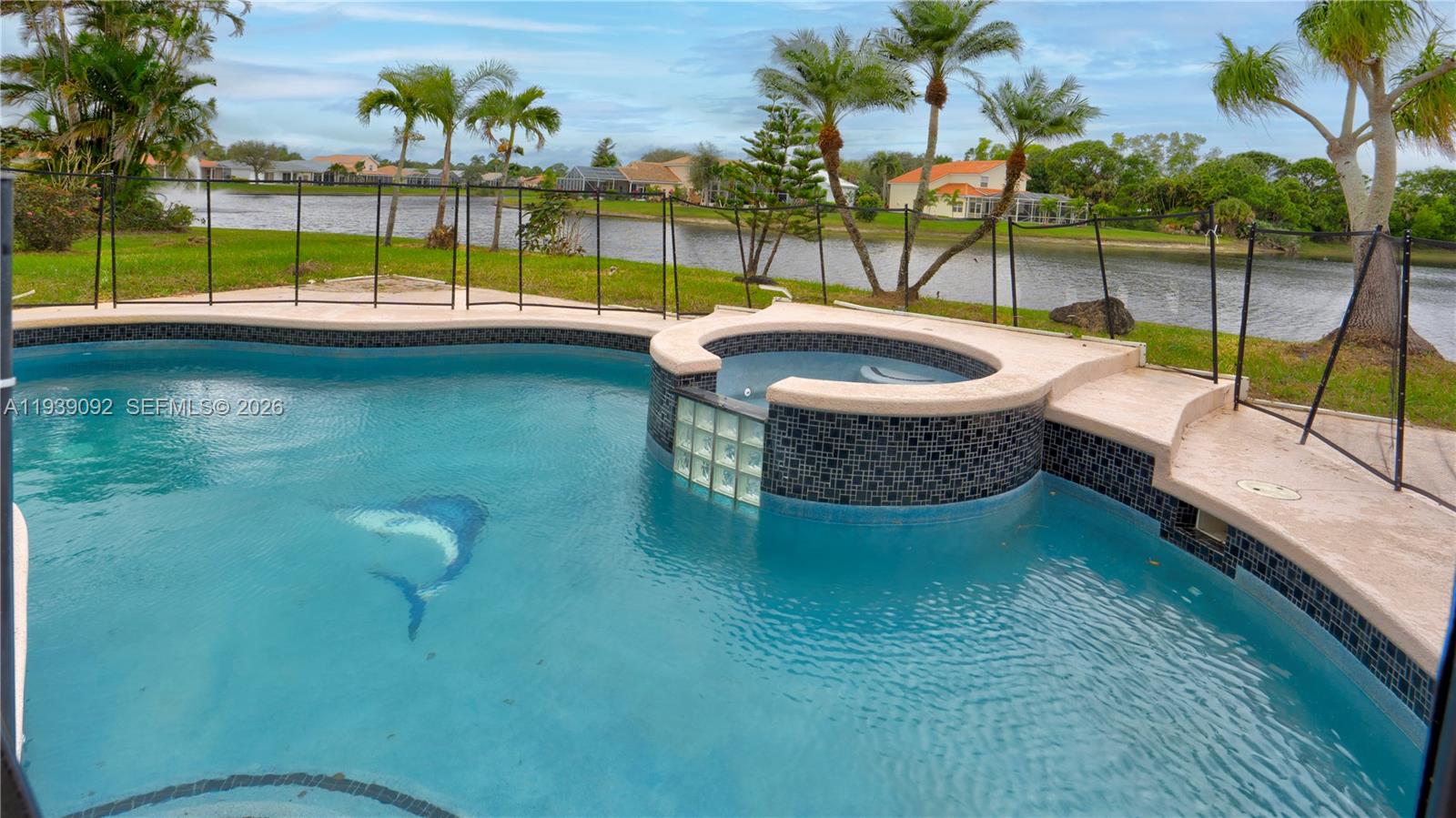 7109 Waldon Pond Stuart, FL 34997 - Photo 5 of 20 swimming pool view with a garden space