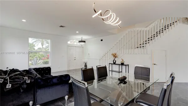 a view of a livingroom with furniture window and wooden floor