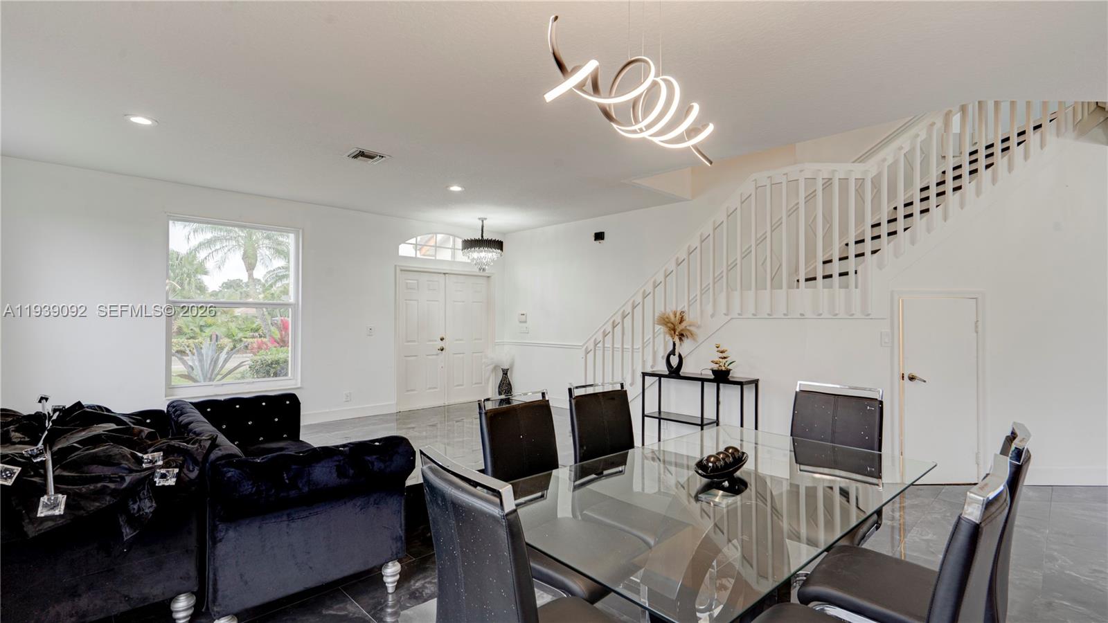 7109 Waldon Pond Stuart, FL 34997 - Photo 9 of 20 a view of a livingroom with furniture window and wooden floor