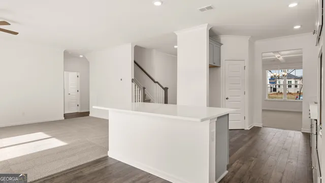 a spacious bathroom with double vanity and a mirror