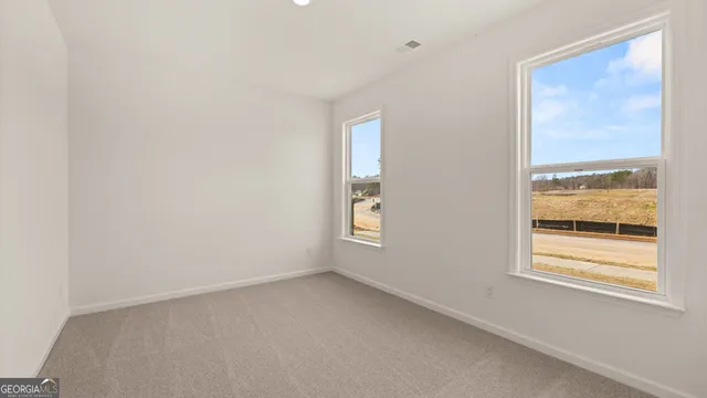 an empty room with windows