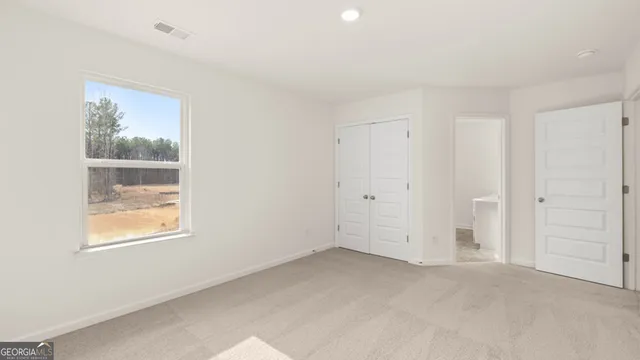 a bathroom with a sink a toilet a mirror a bathtub and shower