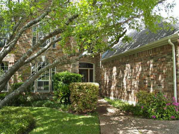 3104 Riva Ridge Road Austin, TX 78746 - Photo 1 of 1 a front view of a house with garden