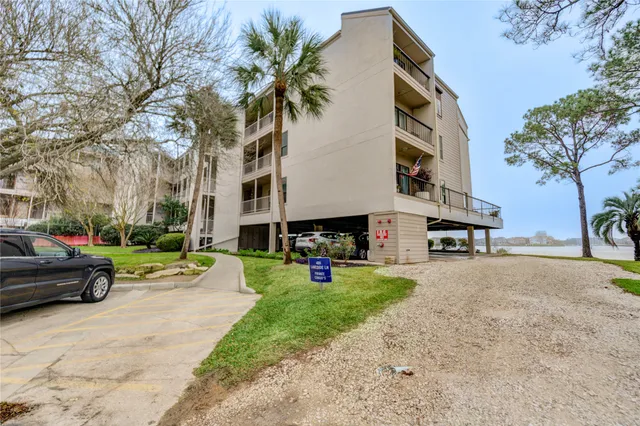 a view of a street with cars parked
