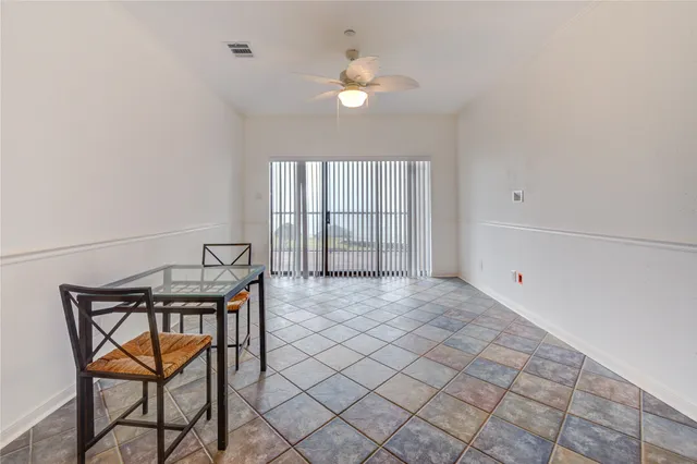 a view of a livingroom with furniture and a stove top oven
