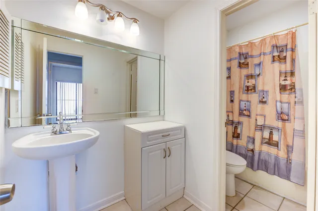 wooden floor in a hall with a window