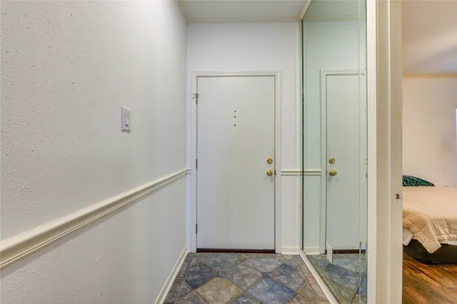a bedroom with furniture and a chandelier