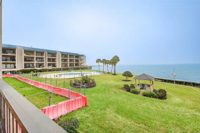 a view of a porch with wooden floor and stairs