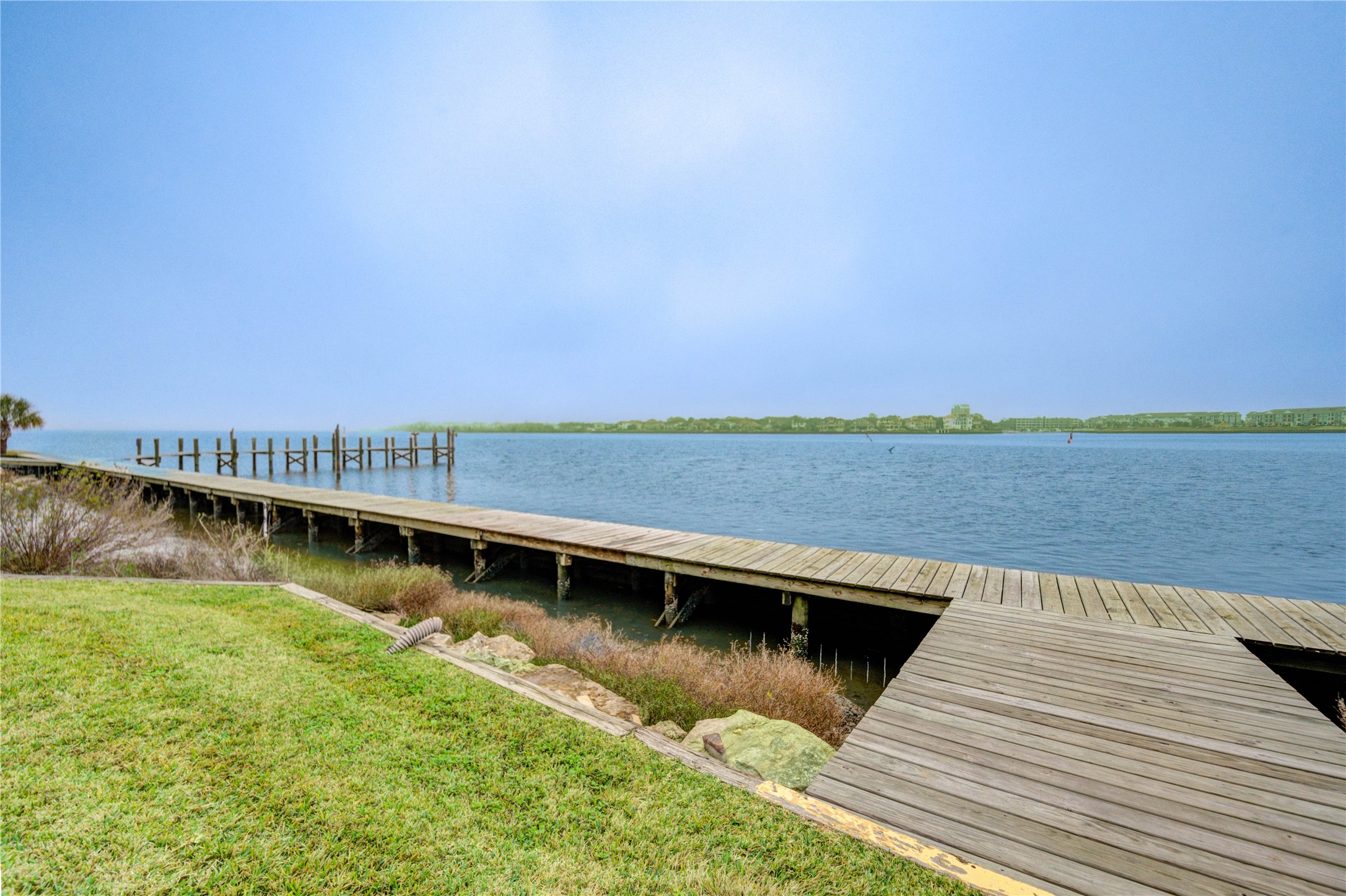 401 Lakeside Lane, Unit 106 Houston, TX 77058 - Photo 39 of 44 a view of a lake with houses in the background