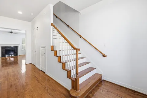 a view of entryway and hall with wooden floor