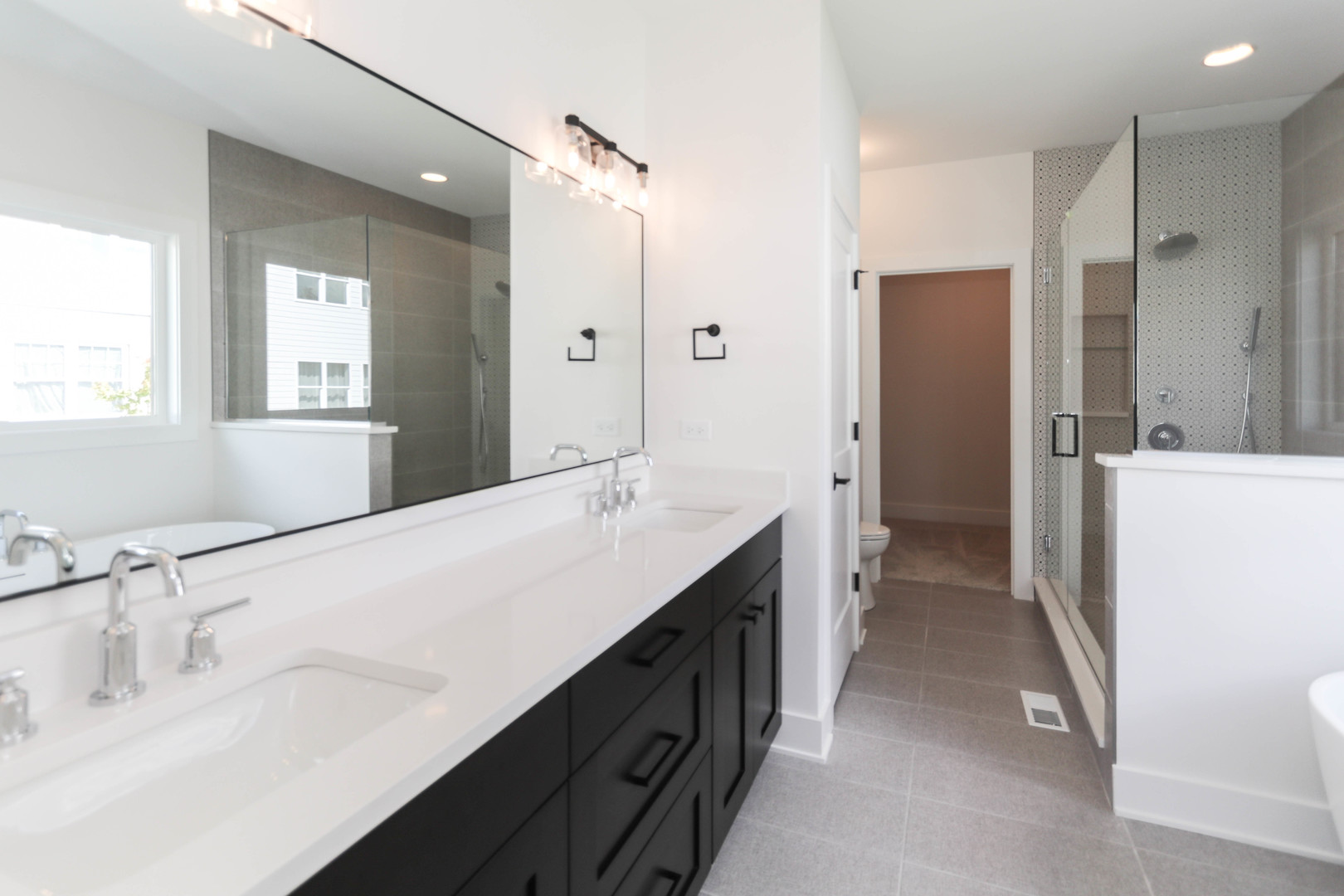 1033 Emerald Drive Naperville, IL 60540 - Photo 14 of 16 a spacious bathroom with a double vanity sink mirror and double