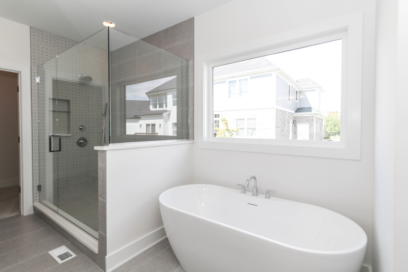 1033 Emerald Drive Naperville, IL 60540 - Photo 15 of 16 a white bath tub sitting next to a window