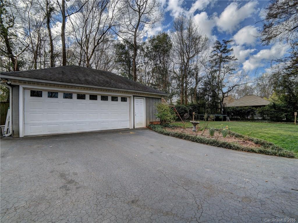 614 Ashworth Road Charlotte, NC 28211 - Photo 22 of 22 a view of house with backyard and bushes