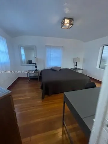 a bedroom with a bed and a cabinets