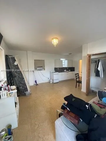 a view of an empty room and utility room