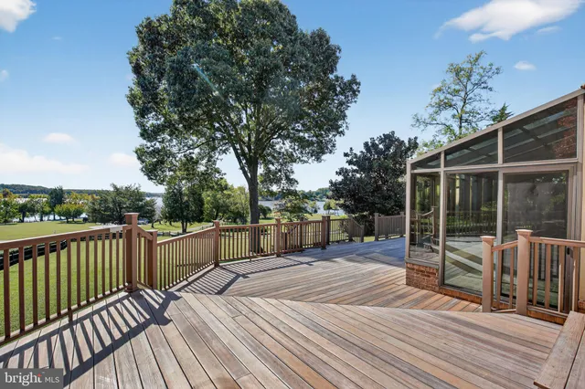 a view of balcony with deck and wooden floor