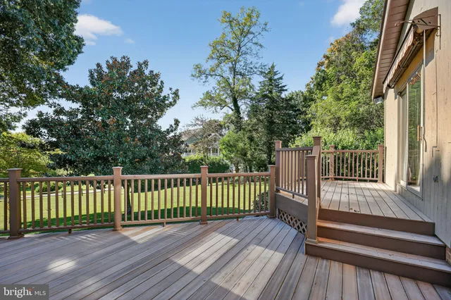 a view of backyard with a deck