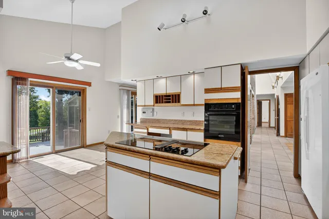 a kitchen with a stove a sink and a refrigerator