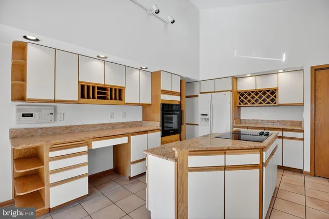 a kitchen with stainless steel appliances a stove sink and microwave