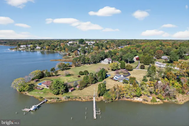 an aerial view of a house with a lake view