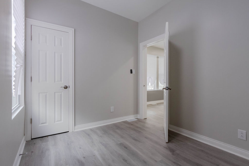 8538 South May Street Chicago, IL 60620 - Photo 15 of 38 an empty room with wooden floor and closet