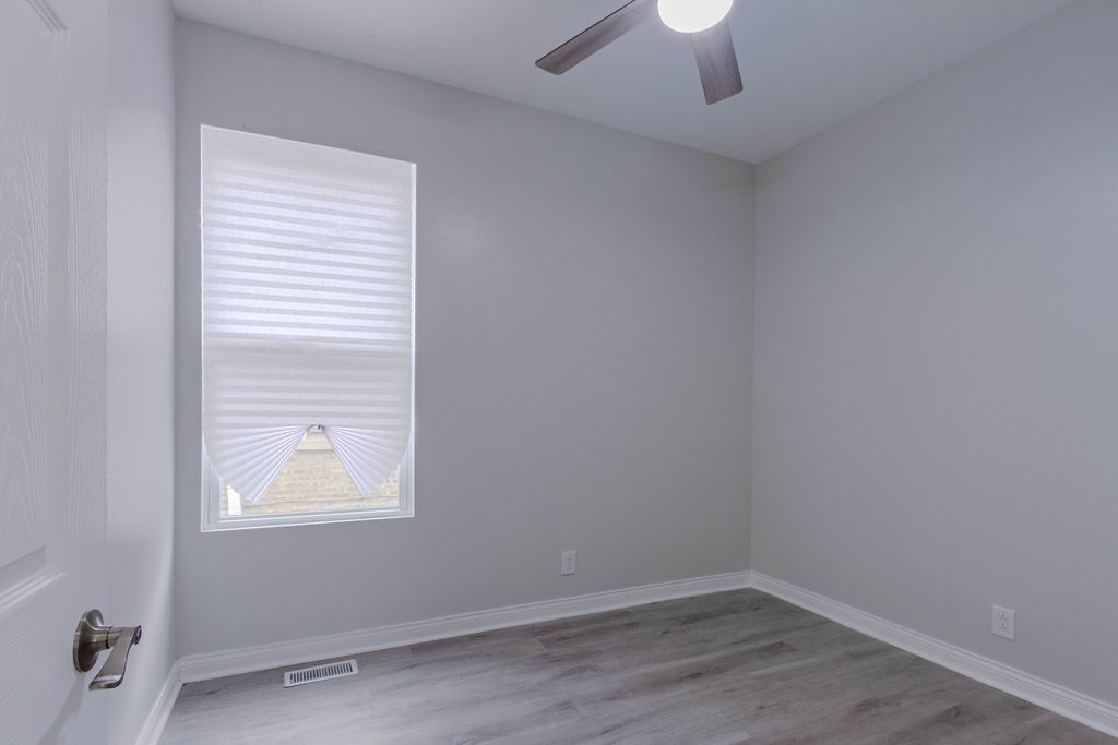 8538 South May Street Chicago, IL 60620 - Photo 17 of 38 an empty room with a window