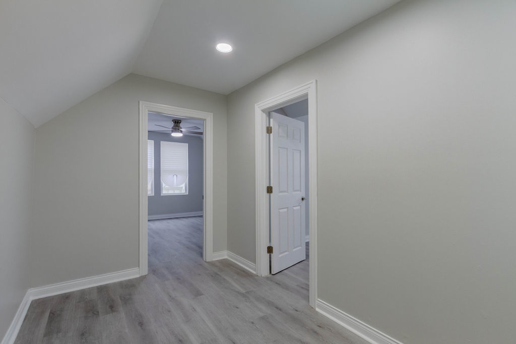 8538 South May Street Chicago, IL 60620 - Photo 25 of 38 a view of a hallway with wooden floor