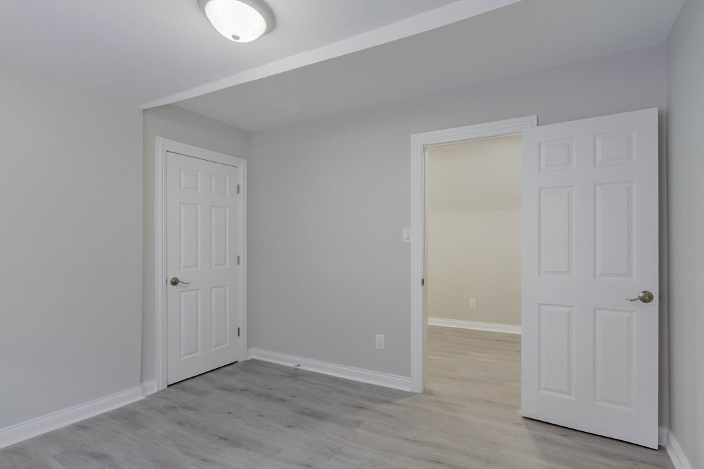 8538 South May Street Chicago, IL 60620 - Photo 29 of 38 a view of an empty room with wooden floor