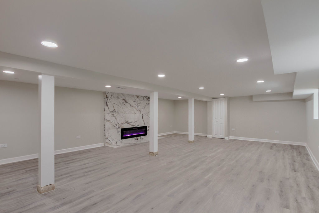 8538 South May Street Chicago, IL 60620 - Photo 31 of 38 an empty room with wooden floor and window
