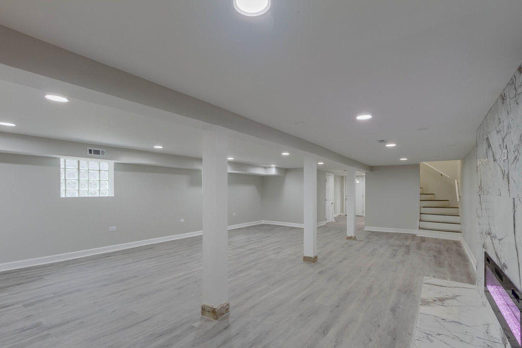 8538 South May Street Chicago, IL 60620 - Photo 32 of 38 an empty room with wooden floor and windows