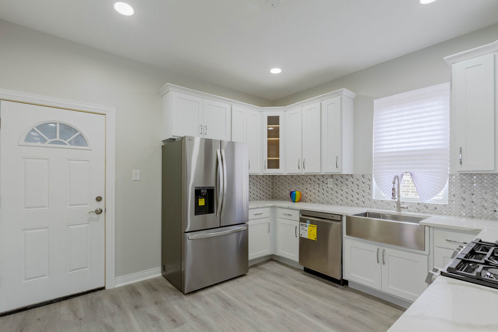 8538 South May Street Chicago, IL 60620 - Photo 8 of 38 a kitchen with a refrigerator sink and cabinets