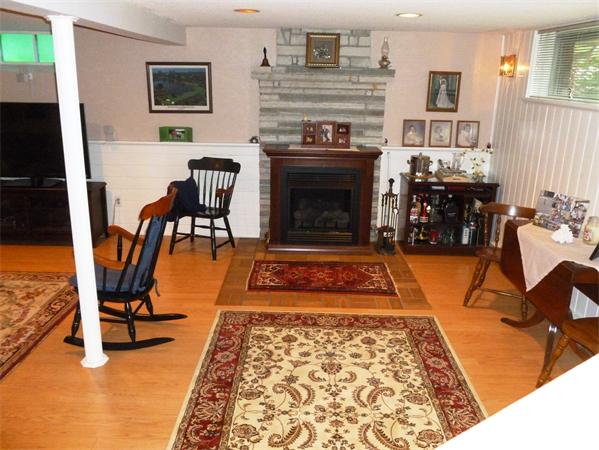 33 Red Bridge Road Wilbraham, MA 01095 - Photo 17 of 21 a living room with furniture a rug and a fireplace