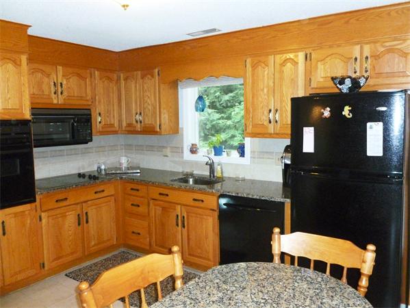 33 Red Bridge Road Wilbraham, MA 01095 - Photo 3 of 21 a kitchen that has a sink and a table in it