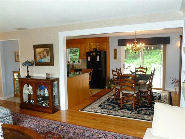 33 Red Bridge Road Wilbraham, MA 01095 - Photo 6 of 21 a dining room with furniture a fireplace and wooden floor