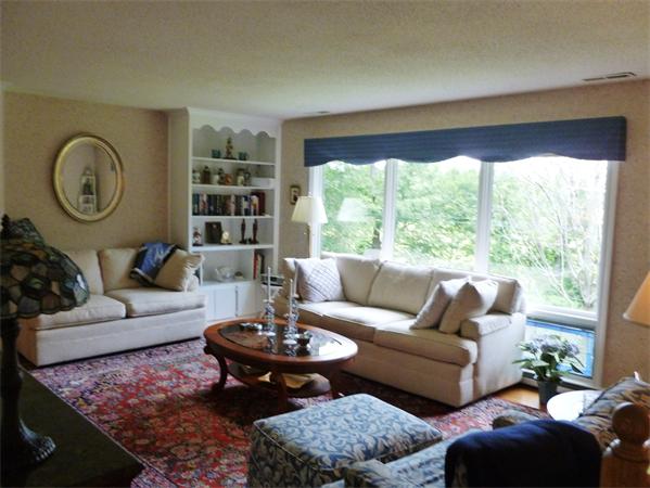 33 Red Bridge Road Wilbraham, MA 01095 - Photo 8 of 21 a living room with furniture a table and a large window