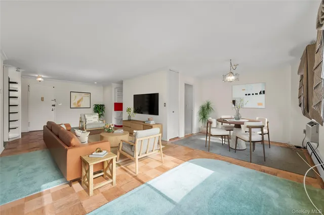 a living room with furniture a rug and a flat screen tv