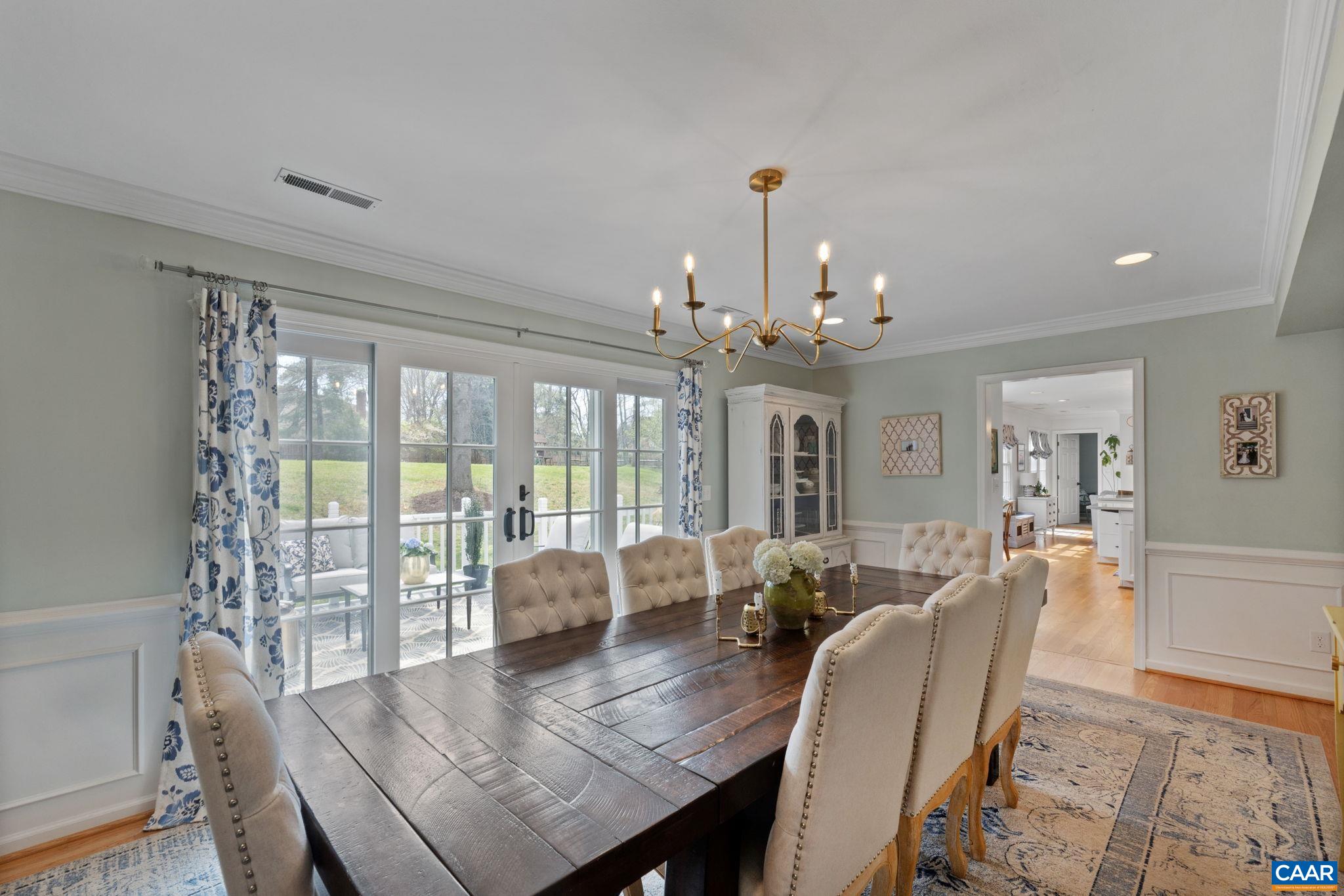 2603 Holkham Drive Charlottesville, VA 22901 - Photo 12 of 60 a view of a dining room with furniture a chandelier and wooden floor