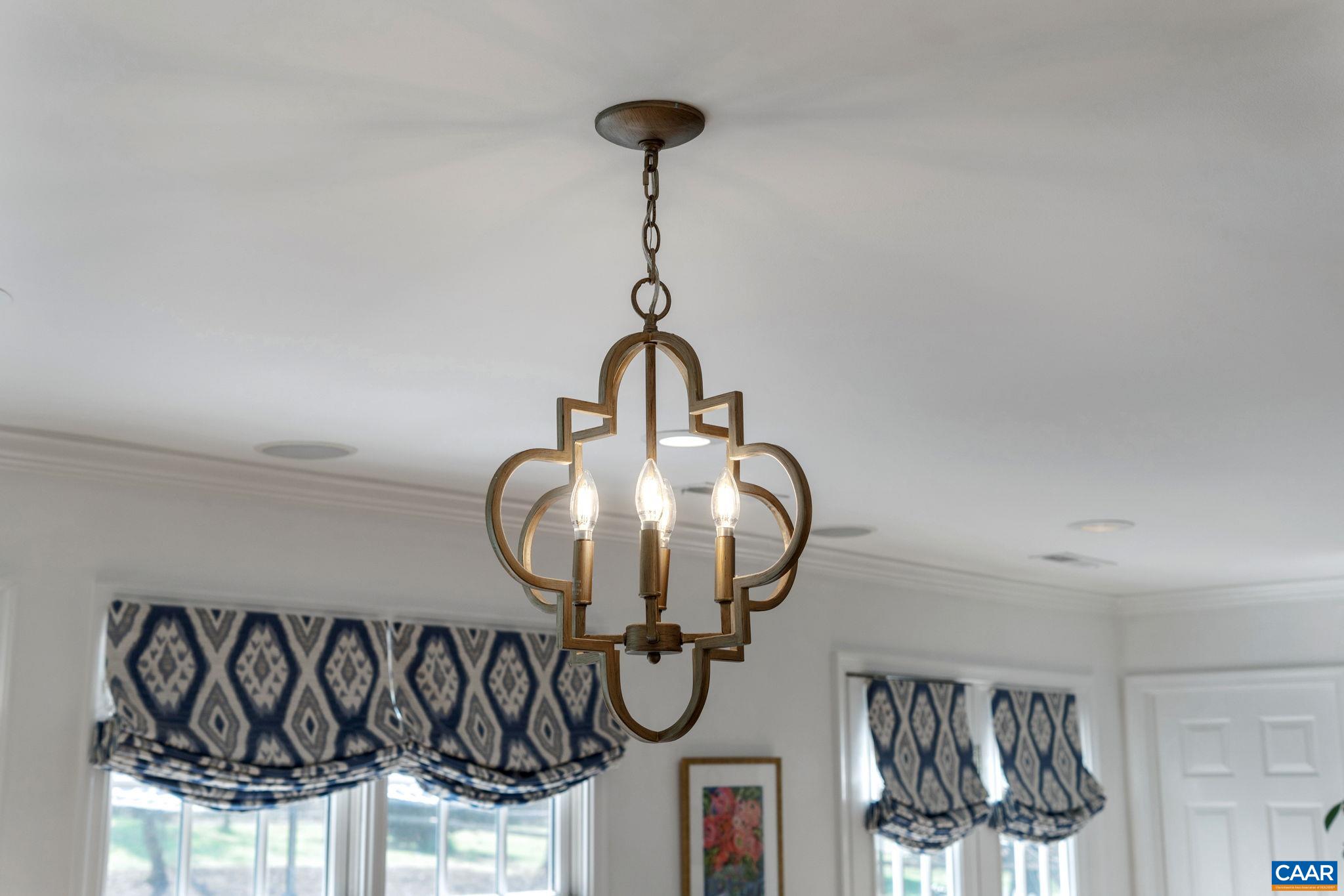 2603 Holkham Drive Charlottesville, VA 22901 - Photo 19 of 60 a bathroom with a mirror and a chandelier