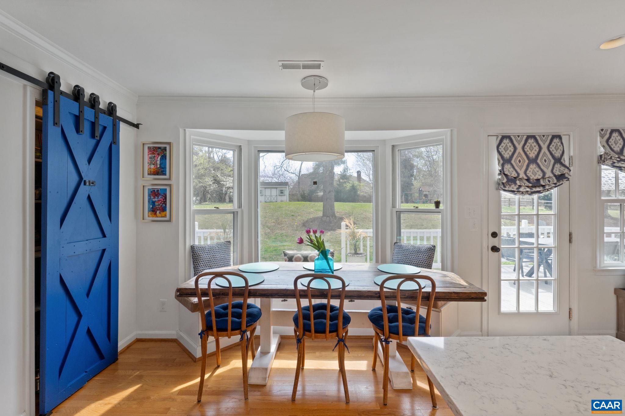 2603 Holkham Drive Charlottesville, VA 22901 - Photo 20 of 60 a view of a dining room with furniture window and outside view