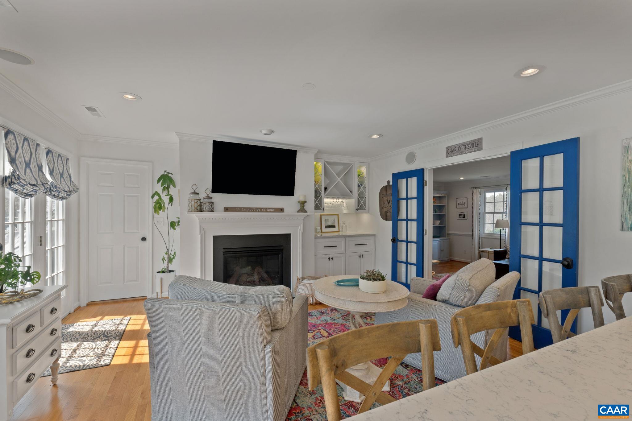2603 Holkham Drive Charlottesville, VA 22901 - Photo 26 of 60 a living room with fireplace furniture and a flat screen tv