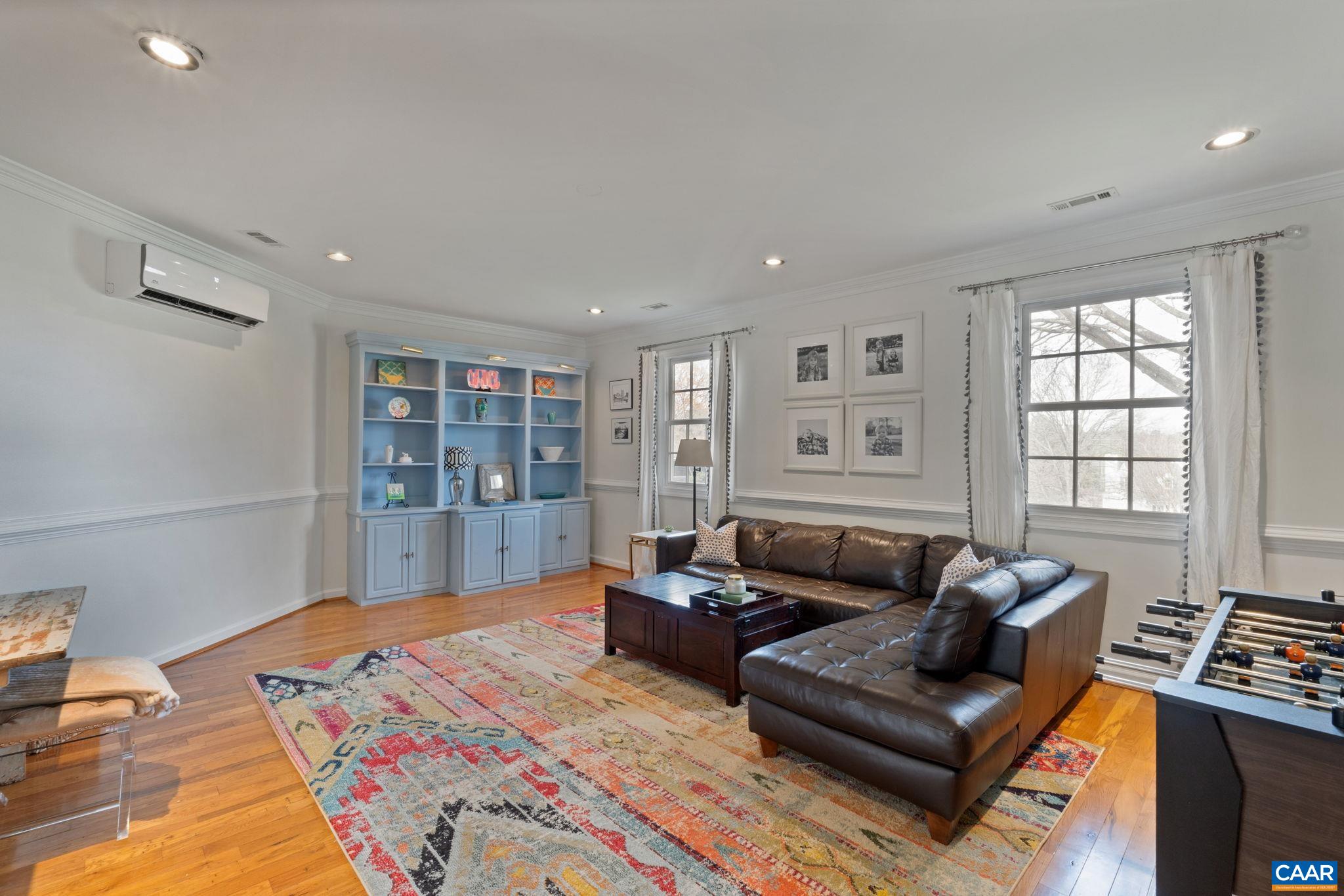 2603 Holkham Drive Charlottesville, VA 22901 - Photo 29 of 60 a spacious bedroom with a bed a couch and a window